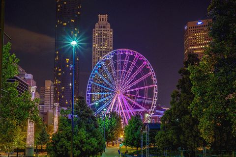 Ferris wheel, Landmark, Metropolitan area, Urban area, Night, Tourist attraction, Light, Metropolis, Sky, City, 