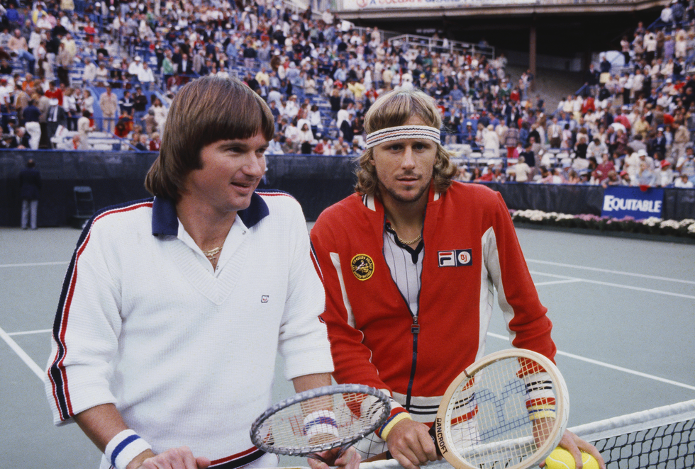 american tennis player jimmy connors left and swedish tennis player bjorn borg stand together beside the net in front of press photographers before the final of the 1978 us open men's singles tennis tournament at the usta national tennis center at flushing meadows in new york on 10th september 1978 connors would go on to beat bjorg in the final 6 4, 6 2, 6 2 to become champion photo by leo masonpopperfoto via getty images