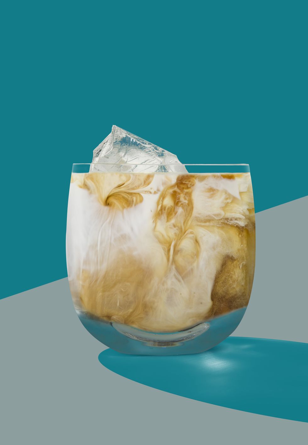 white russian cocktail shot in a flat art deco style on a graphic turquoise and grey background with a defined shadow