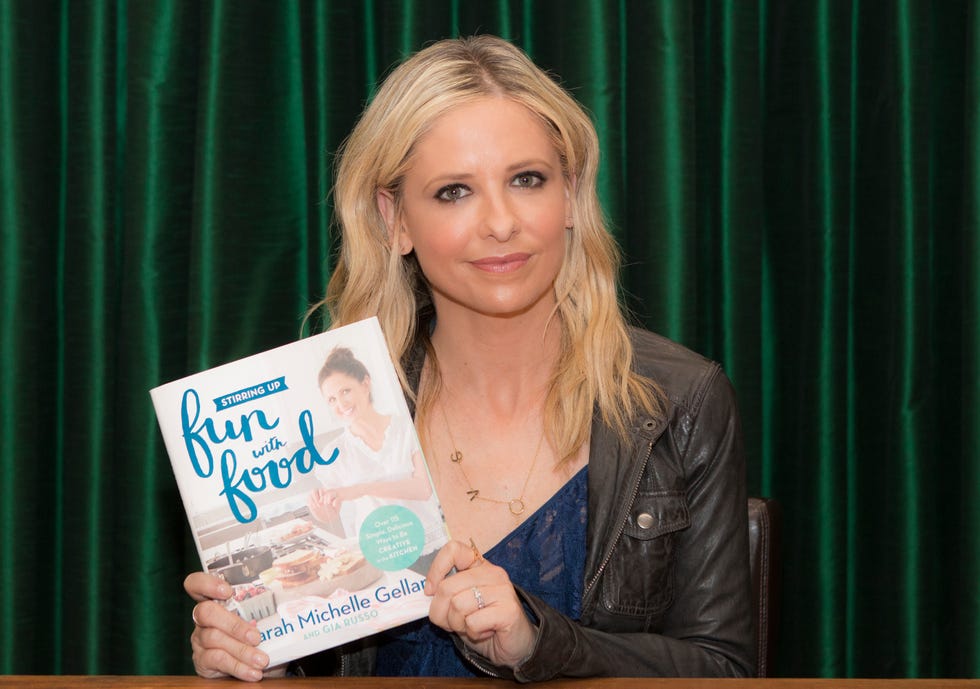Sarah Michelle Gellar in 2017 with a copy of her book, "Stirring Up Fun With Food: Over 115 Simple, Delicious Ways To Be Creative In The Kitchen"