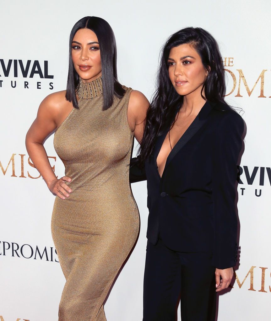hollywood, ca april 12 tv personalitiessisters kim kardashian west l and kourtney kardashian attend the premiere of open road films the promise at tcl chinese theatre on april 12, 2017 in hollywood, california photo by david livingstongetty images