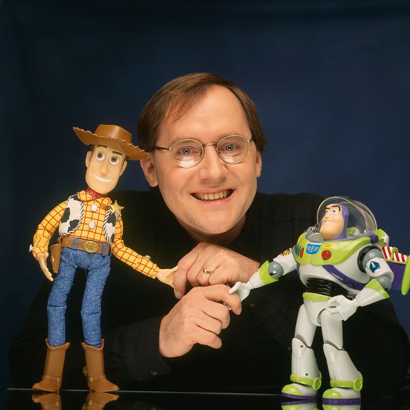 john lasseter with two of his characters from the film toy story, woody and buzz lightyear photo by eric robertsygmasygma via getty images