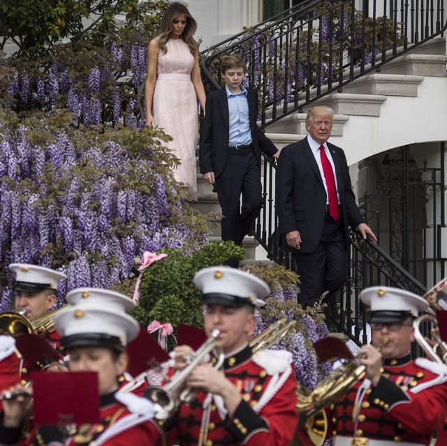 President Donald Trump with first lady Melania Trump and their son Barron Trump walk down from the Truman Balcony after speaking during the 139th Easter Egg Roll on the South Lawn of the White House in Washington, DC on Monday, April 17, 2017.
