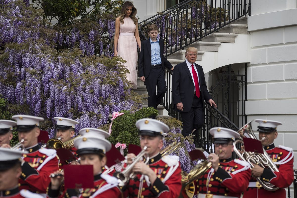 President Donald Trump with first lady Melania Trump and their son Barron Trump walk down from the Truman Balcony after speaking during the 139th Easter Egg Roll on the South Lawn of the White House in Washington, DC on Monday, April 17, 2017.