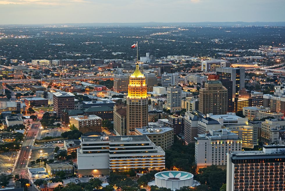aerial view of downtown san antonio illuminated at dusk with tower life building