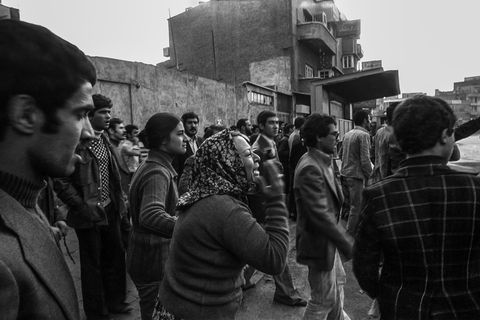 a demonstrator protests the violent action taken by armed forces in in tehran in 1978