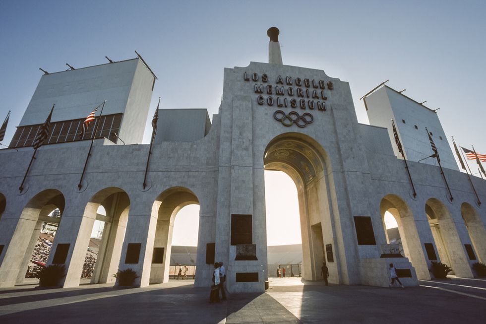 los angeles memorial coliseum with a large archway