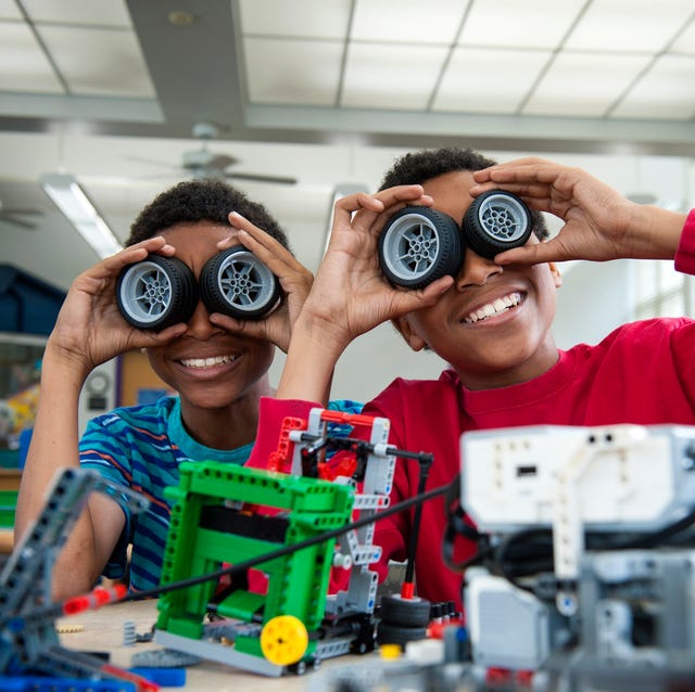 boys playing with toy wheels