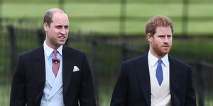 a photo of prince harry and prince william walking together at pippa middleton's wedding to james matthews