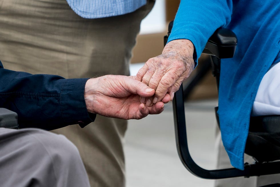 George H.W. Bush and Barbara Bush hold hands during a ceremony in May 2017.