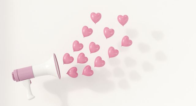 Megaphone with pink heart-shaped balloons as sound waves, 3d rendering