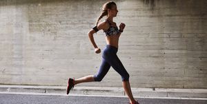 Female runner running on urban street