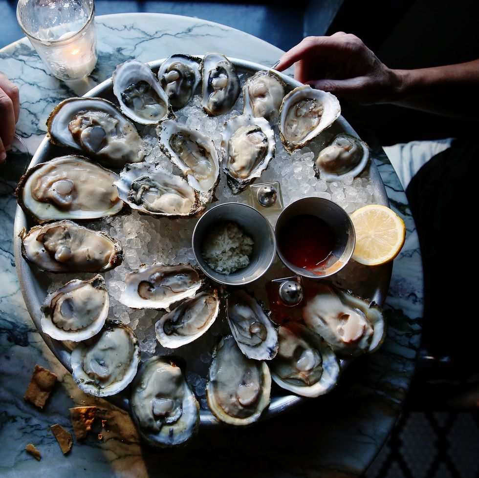 A couple enjoying raw oysters