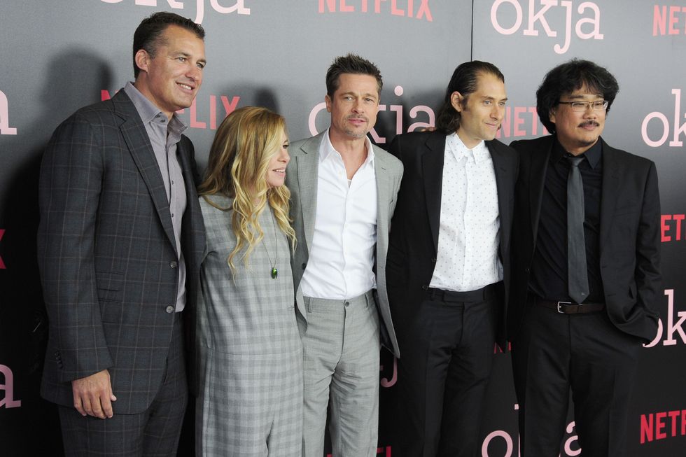 new york, ny june 8 l r scott stuber, dede gardner, brad pitt, jeremy kleiner and bong joon ho attend netflix hosts the new york premiere of okja at amc lincoln square theater on june 8, 2017 in new york city photo by paul bruinoogepatrick mcmullan via getty images