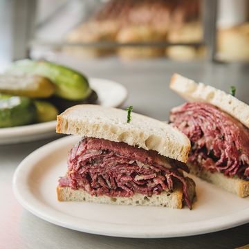 pastrami sandwich on an old fashioned deli counter with a bell