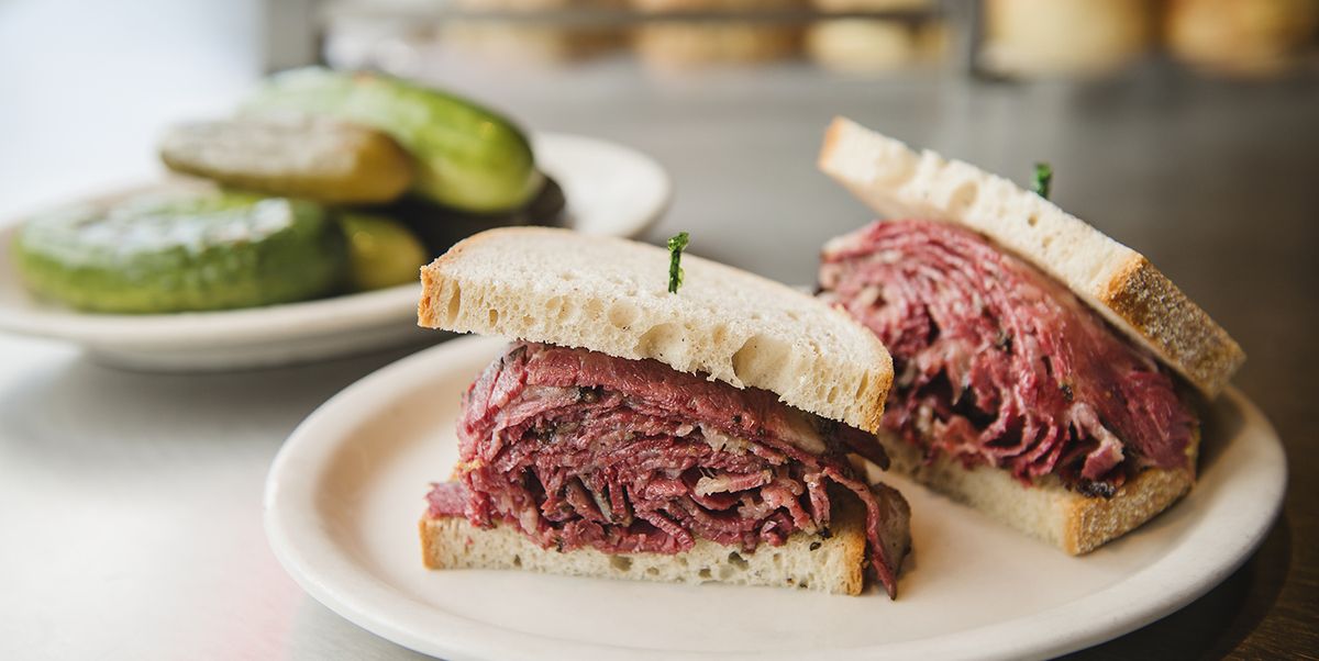 pastrami sandwich on an old fashioned deli counter with a bell