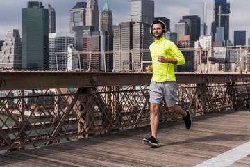 a man running on a bridge