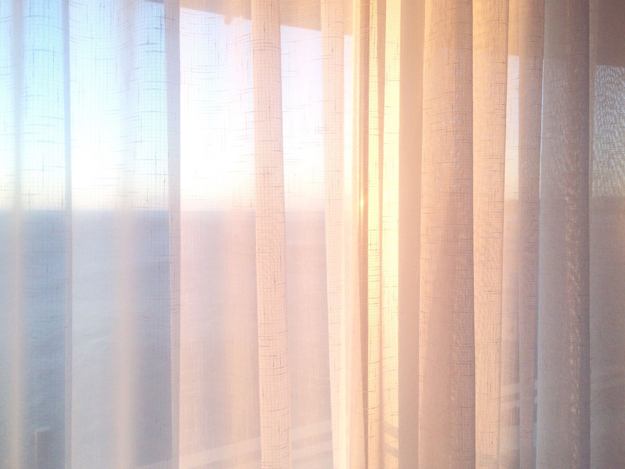 Close-Up Of White Curtains On Window