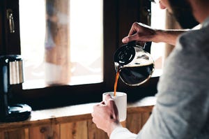 man pouring coffee