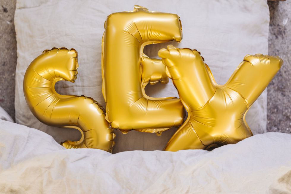 Inflatable letters sex in bed