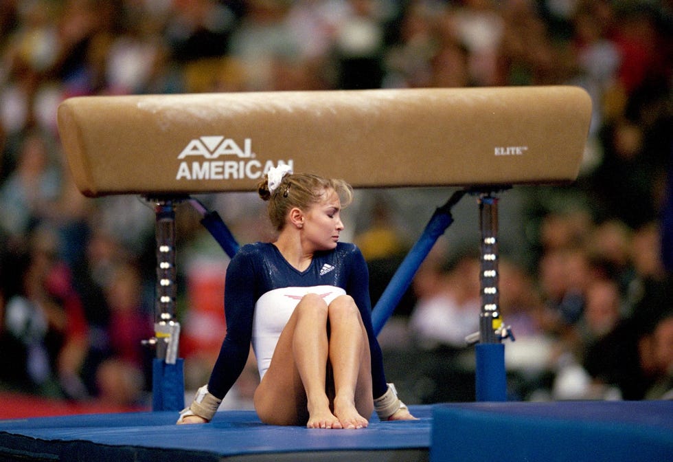 20 aug 2000 shannon miller sits on the mat after she sprained her knees on the vault landing during the us women's olympic gymnastics trials at the fleet center in boston, massachusettsmandatory credit doug pensinger  allsport