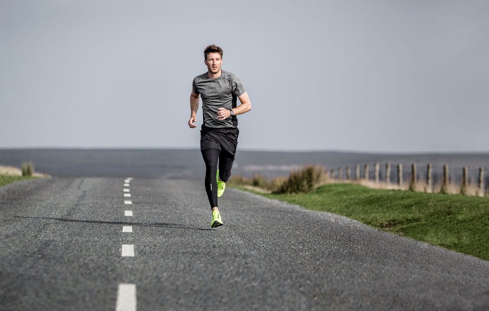 person running on a deserted road