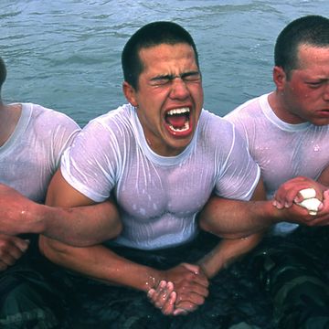 san diego   undated  navy seal trainees lock arms upon entering the frigid pacific waters in this undated photo taken in 2000 at the coronado naval amphibious base in san diego, california hell week at this beach in san diego is exactly what it sounds like for third week navy trainees who are subjected to nearly unimaginable physical and mental trials only the strongest survive the nonstop physical exercise of jogging for miles in deep sand, carrying heavy rubber boats back and forth through the surf, crawling through mud under simulated machine gun fire, and doing myriads of pushups on demand hunger, thirst and hallucinations are among the symptoms the men experience, often after only two days the recruits are divided into teams, and if a team fails to complete a task in the allotted time, all its members must carry "old misery," a 350 pound log  fewer than half the men survive the week to become seals, an elite maritime commando force  photo by joe mcnallygetty images