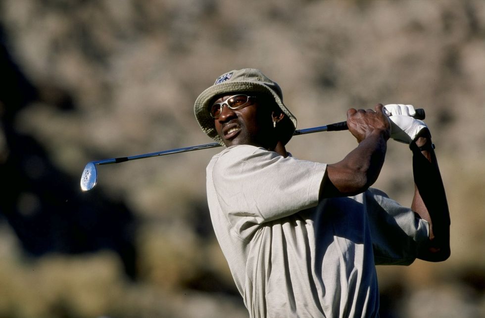 22 jan 1999 michael jordan watches the ball during the bob hope chrysler classic at the indian wells country club in indian wells, california mandatory credit jon ferry  allsport