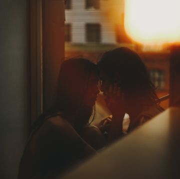a man and woman kissing