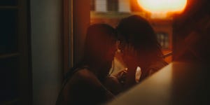 a man and woman kissing