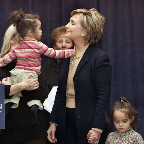 new york, united states  senator hillary rodham clinton d ny lets olivia harden play with her pearl necklace while her sister camilla looks on during a speech at the ryan chelsea clinton community health center 21 january 2007 where she announced legislation to make health insurance available to all children the speech came a day after clinton tossed her hat into the 2008 presidential race      afp phototimothy a clary  photo credit should read timothy a claryafp via getty images