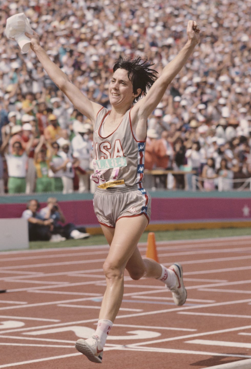 joan benoit of the united states raises her arms in celebration after winning the first ever olympic womens marathon event at the xxiii olympic summer games on 5th august 1984 at the los angeles memorial coliseum in los angeles, california, united states photo by tony duffyallsportgetty images