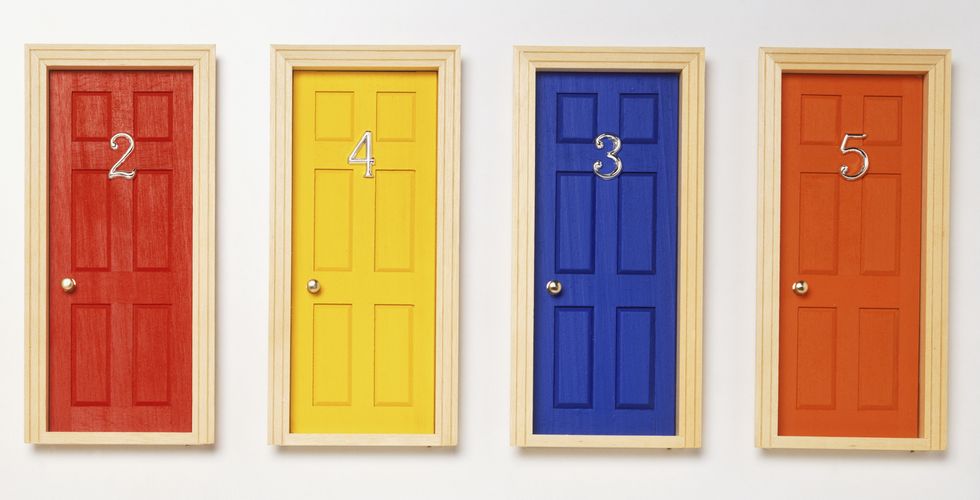 Four front doors, numbered two, three, four and five and coloured red, yellow, blue and orange.
