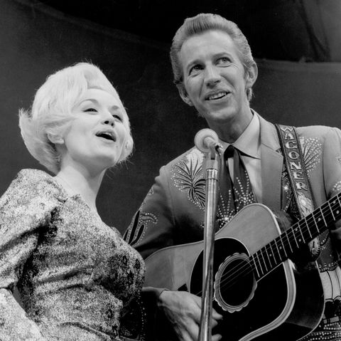 circa 1967 country singer dolly parton and her collaborator porter wagoner perform onstage in circa 1967 mr wagoner is wearing a nudie suit designed by nudie cohn of nudies rodeo tailors photo by michael ochs archivesgetty images