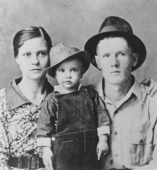 tupelo, ms 1937 rock and roll singer elvis presley poses for a family portrait with his parents vernon presley and gladys presley in 1937 in tupelo, mississippi photo by michael ochs archivesgetty images