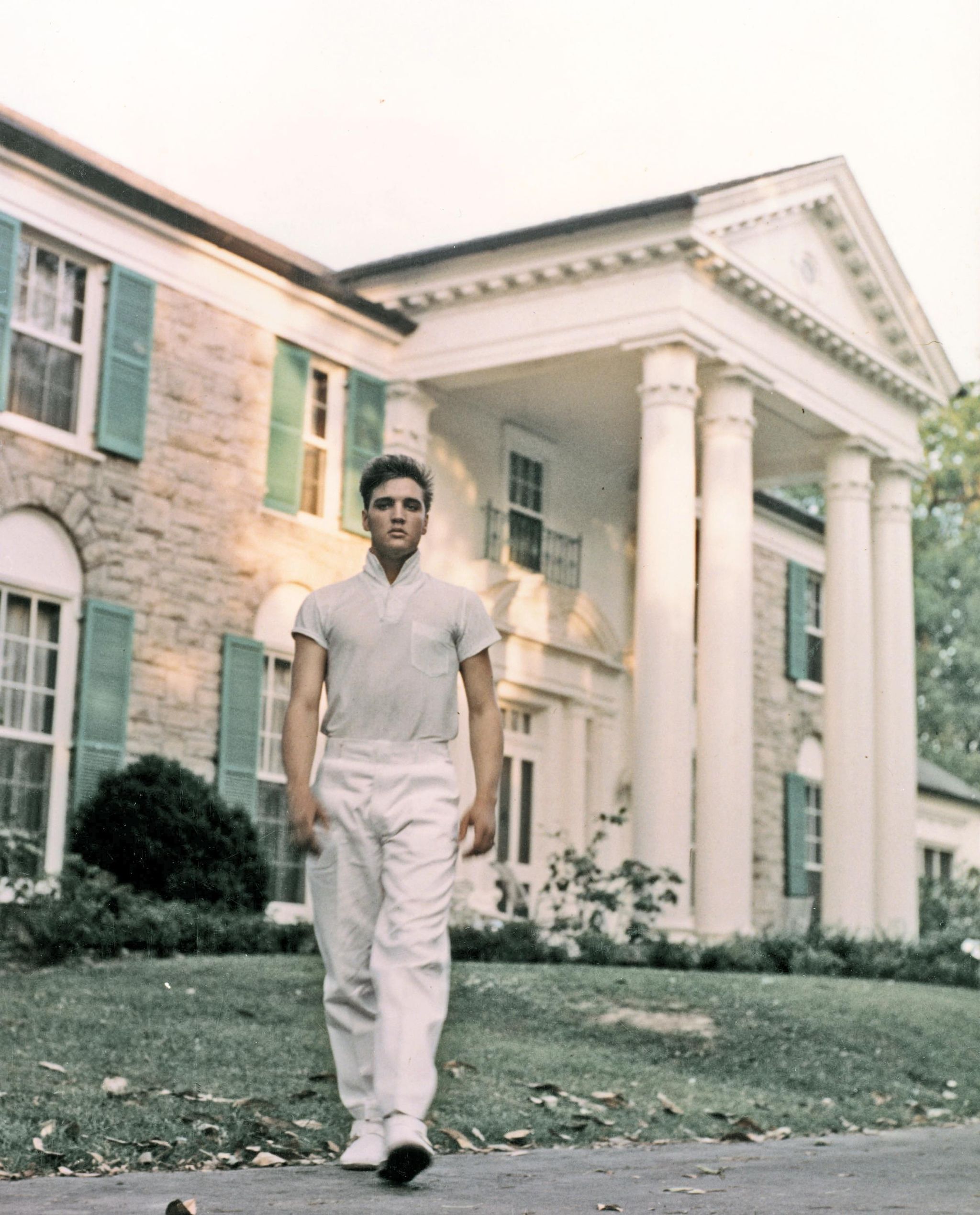 memphis, tn   circa 1957  rock and roll singer elvis presley strolls the grounds of his graceland estate in circa 1957 photo by michael ochs archivesgetty images
