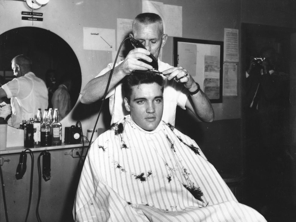 Elvis Presley gets his hair shorn off in preparation for his tour of duty in in the United States Army