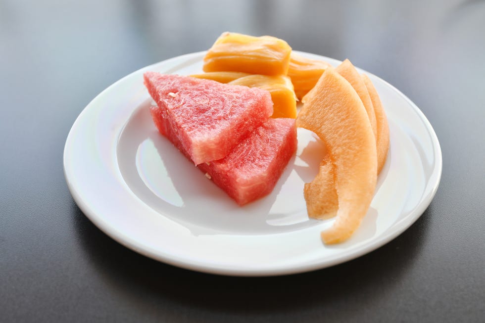Slices Of Various Fruits In Plate Served On Table