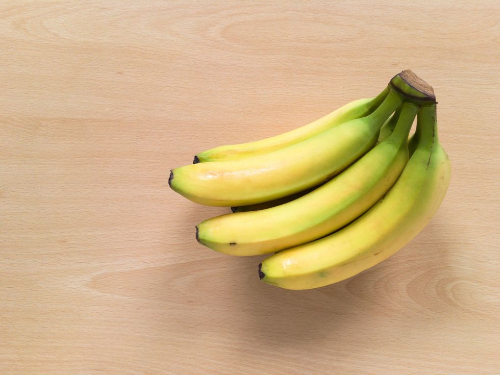 Directly Above Shot Of Bananas On Wooden Table