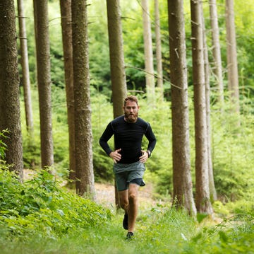Man running in forest man running in forest