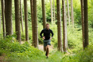 man running in forest