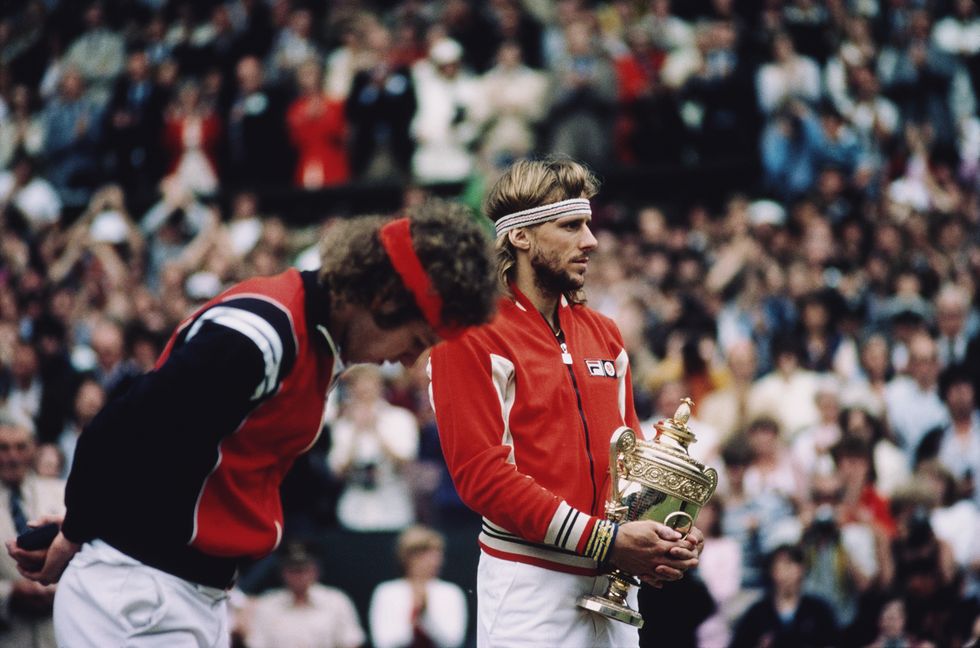 bjorn borg of sweden holds the gentleman's singles trophy as john mcenroe looks down after losing their men's singles final match at the wimbledon lawn tennis championship on 5th july 1980 at the all england lawn tennis and croquet club in wimbledon in london, england photo by steve powellallsportgetty images