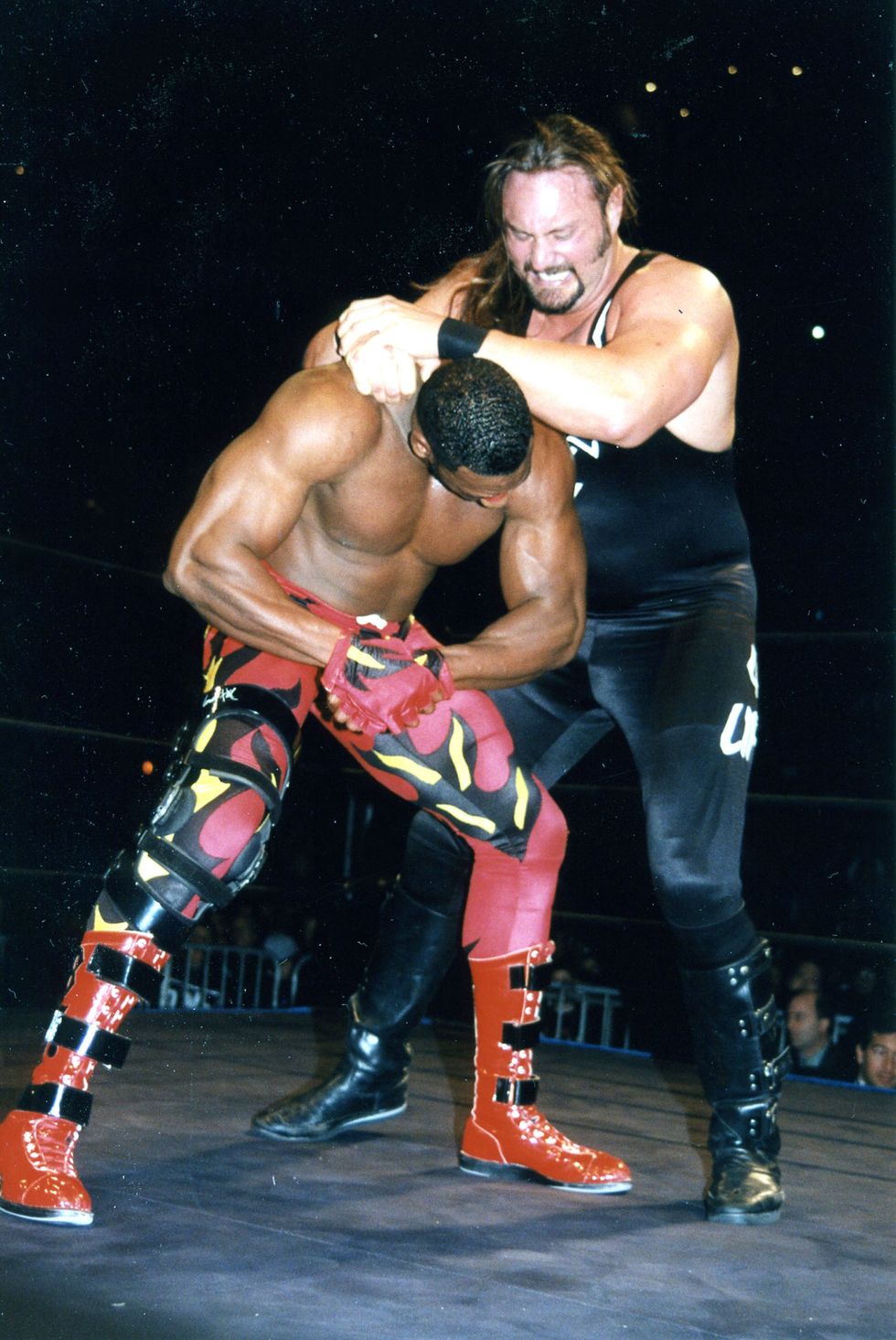 Booker T battling Brian "Crush" Adams in 1998