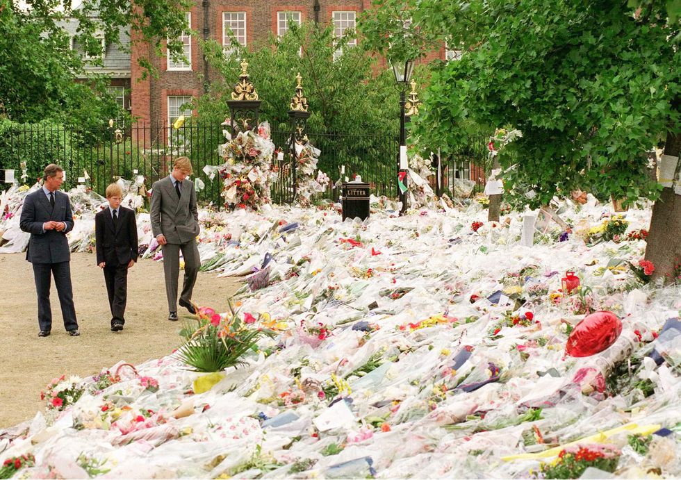london september 1997 prince william, prince of wales, with his sons princes william and harry looking at floral tributes left at kensington palace following the death of diana, princess of wales in september, 1997 photo by anwar husseinwireimage