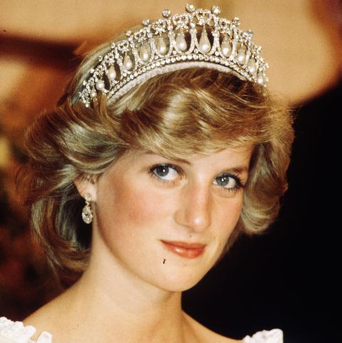 auckland, new zealand   april 29 diana, princess of wales, wearing a cream satin dress by gina fratini with the queen mary cambridge lovers knot tiara and diamond earrings attends a banquet on april 29, 1983 in auckland, new zealand photo by anwar husseinwireimage