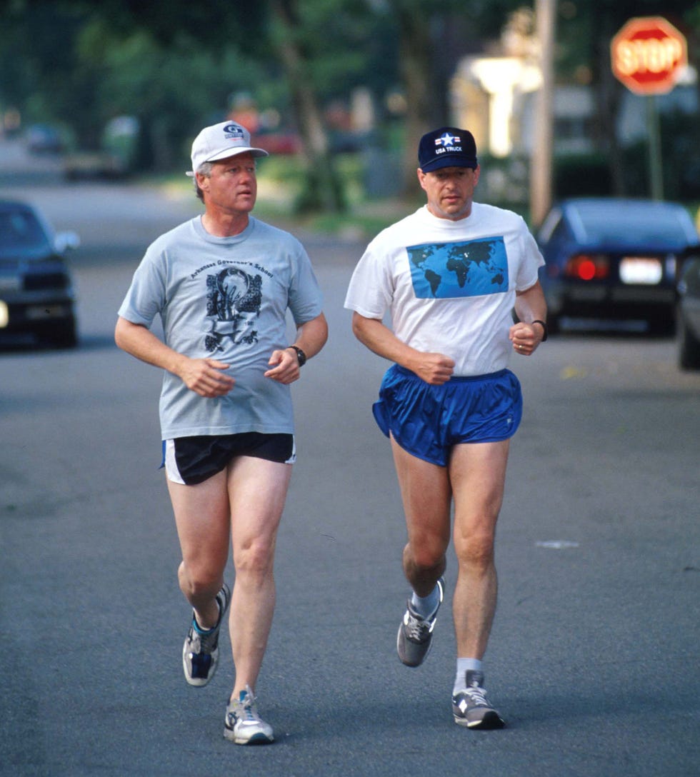 two men running in a street