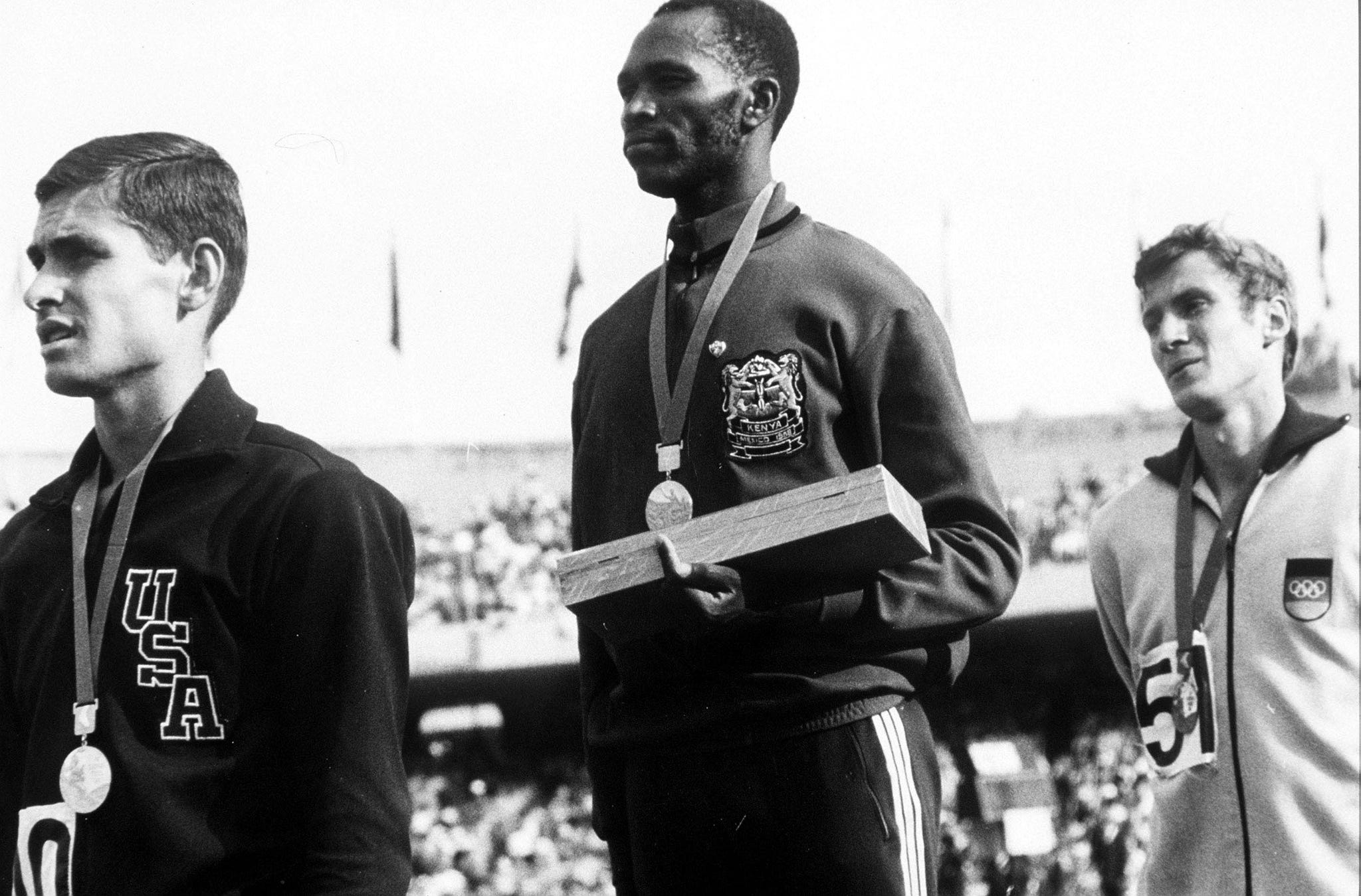 1968 olympic games, mexico city, mexico, mens 1500 metres final, kenyan gold medallist kip keino stands on the podium with usas silver medallist jim ryan l and german bronze medallist bodo tummler  photo by popperfoto via getty imagesgetty images