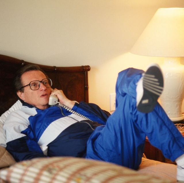 los angles, ca   1990  cnn talkshow host, larry king, reclines on his hotel bed during a 1990 beverly hills, california, photo portrait session kings one hour tv show is viewed by millions throughout the world photo by george rosegetty images