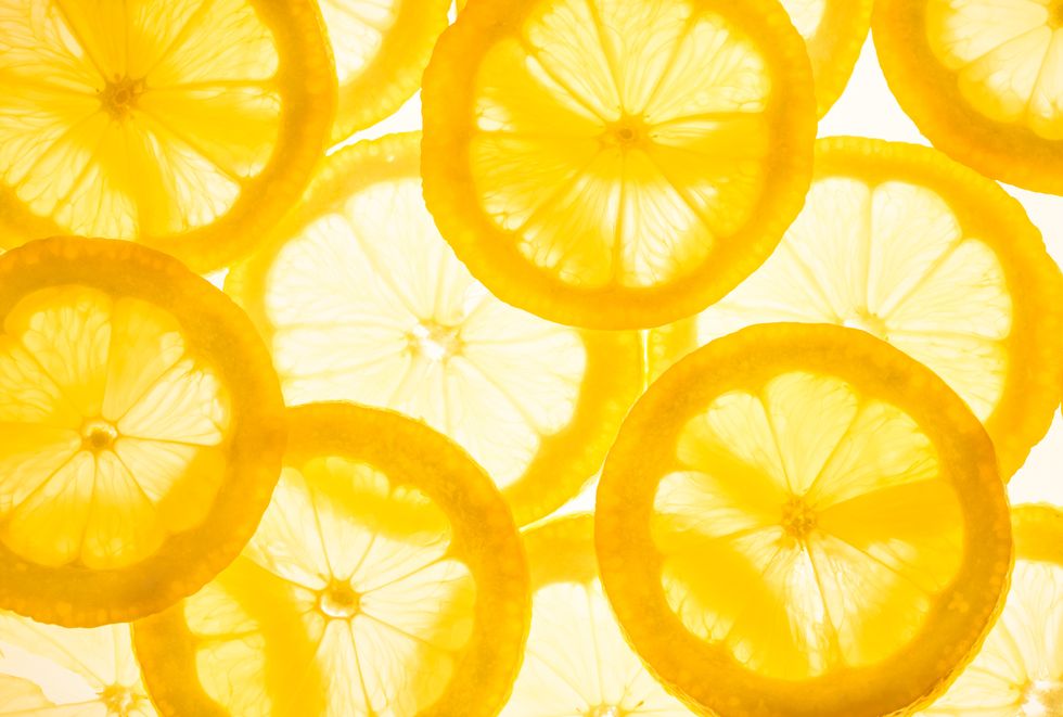 fresh lemon slicesyellow food background
