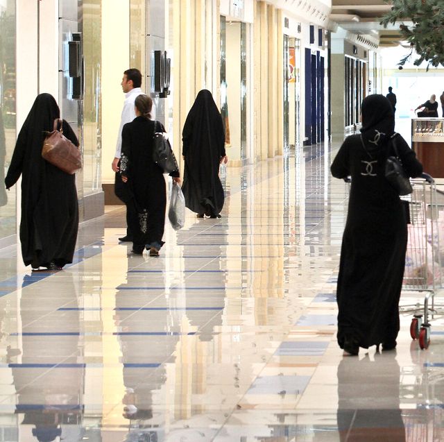 Saudi women walk at a shopping mall in t